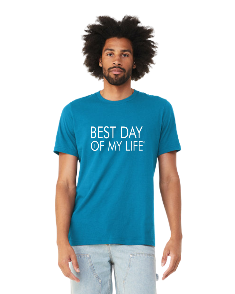 dark skinned person with afro wearing an aqua crewneck t-shirt with best day of my life written in white with a cross in the O