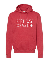 red pullover hoodie with best day of my life written in white and a cross in the O