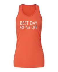 orange tank top with best day of my life written across in white and a cross in the O