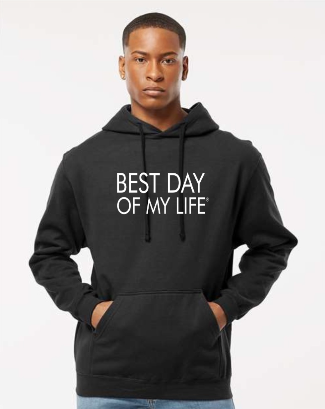 dark-skinned person with short hair wearing a black pullover hoodie with best day of my life written in white lettering