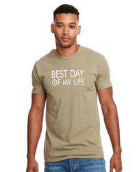 Medium skinned man wearing a light green t-shirt with 'BEST DAY OF MY LIFE' text on a white background