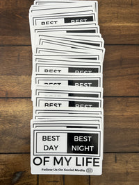 Thumbnail for stack of stickers on wooden background, graphic of a white and black sticker on a grey background. sticker reads best day best night of my life